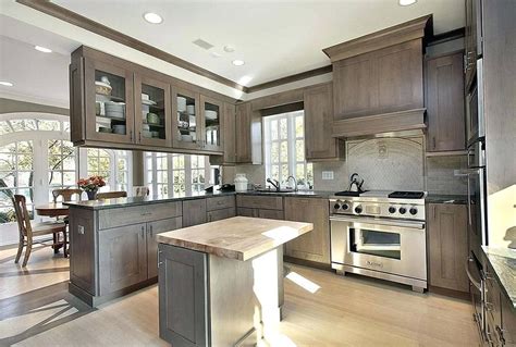 Cabinets can account for nearly 40 percent of a kitchen's cost. Cabinets-close to Maple with flint stain? | Gray stained kitchen cabinets, Stained kitchen ...