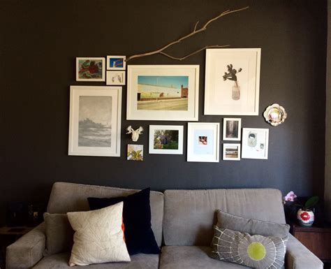 updated living room salon hang / gallery wall above couch / dark gray ...