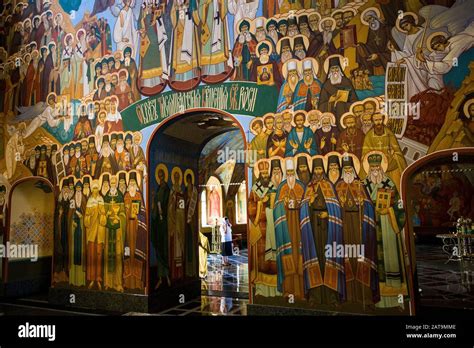 Woman Praying And Fresco Icons Inside Bogoyavlensky Cathedral Stock