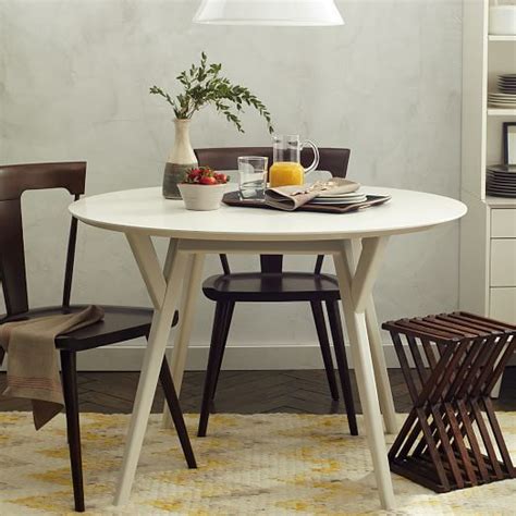 While there are many options out there for reproductions of mid century modern dining tables, some might enjoy hunting for a vintage table with a rich history. Mid-Century Round Dining Table | west elm