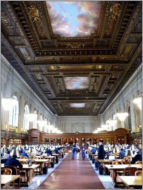 People Are Sitting At Desks In The Middle Of A Large Room With Ornate