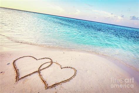 Two Hearts Drawn On Sand Of A Tropical Beach At Sunset Photograph By