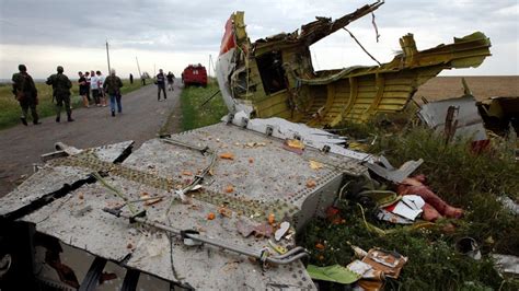 Warning Graphic Content Wreckage From Malaysia Jetliner Crash Site In