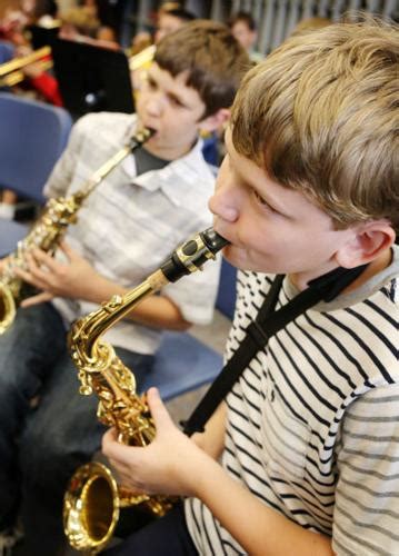Banding Together Students Choose Musical Instruments To Suit Their