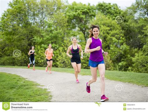 Group Of People Enjoying In The Fitness Having Fun Running Outside
