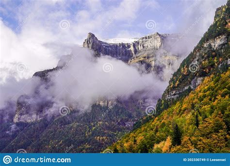 Peak Of Monte Perdido Mount Perdido With Autumn Forest Trees As