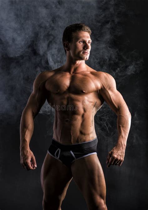 Attractive Shirtless Muscular Man Standing In Underwear Stock Photo