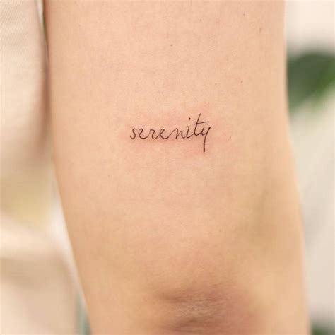 Serenity Lettering Tattoo Handwritten On The Tricep