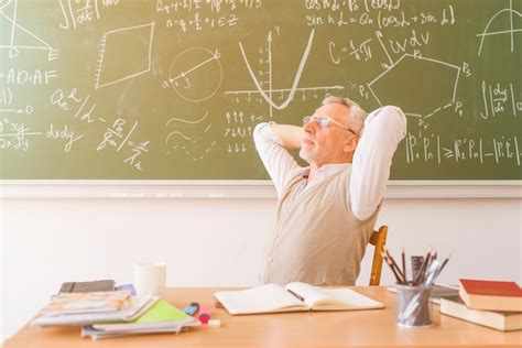 Free Photo Aged Professor Relaxing In Classroom