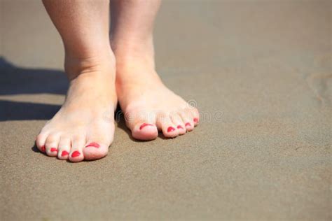 Woman Feet With Red Pedicure Relaxing On Sand Stock Image Image Of Activity Foot