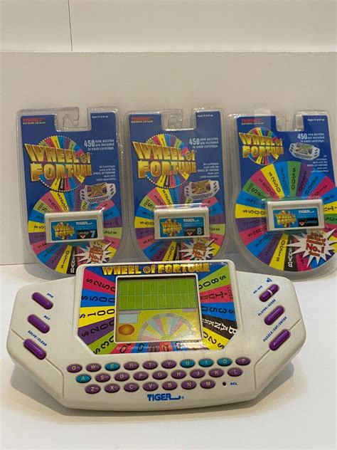 Vintage Tiger Wheel Of Fortune Handheld Electronic Game W 3 Cartridges