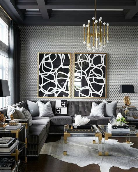 The grey settee, rugs and greyish tones in the brick are gold and grey commingle in this living room, where a striking wood wall acts as the divider between the window seat beyond. PRIME RESIDENCE DECOR on Instagram: "👌Grey, black, gold ...