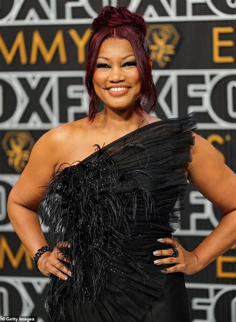garcelle beauvais stuns in a black feathered dress showcasing her sculpted arms at the 2024