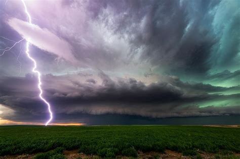 A Massive Lightning Strike In Front Of Some Dramatic Clouds National