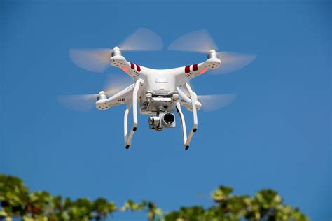 Drone Flying Against Blue Sky · Free Stock Photo