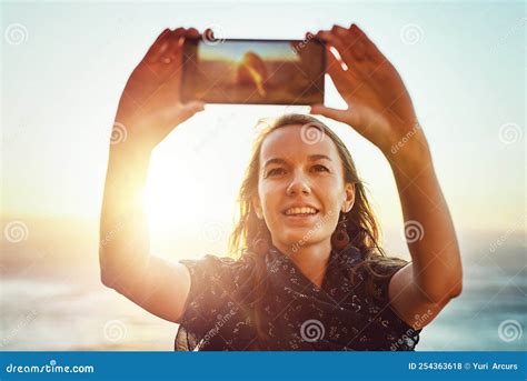 Capturing Each Moment A Young Woman Taking A Selfie Outside Stock