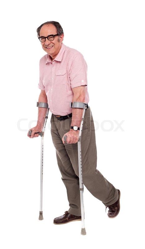 Smiling Elderly Man With Crutches Stock Photo Colourbox