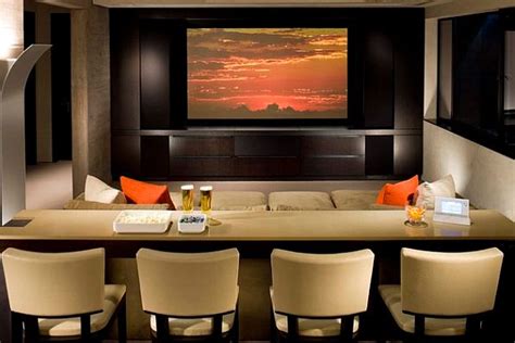 Maybe you would like to learn more about one of these? Theater styled media room with built in dining bar - Decoist