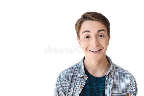 Head And Shoulders Shot Of Excited Caucasian Teen Boy Looking At Camera