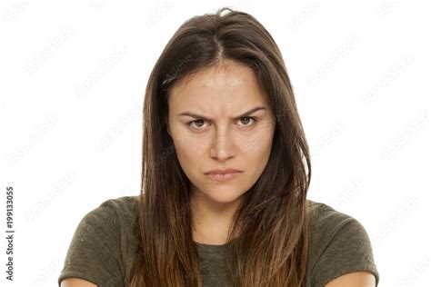 Beautiful Angry Woman Without Makeup On White Background Stock Photo