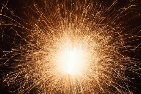 Long Exposure Of Sparkler With Flying Sparks At Night Stock Image