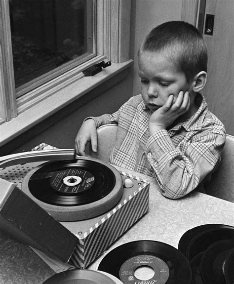 1960s 1970s Boy With Buzz Haircut Listening To Music On Portable 45 Rpm