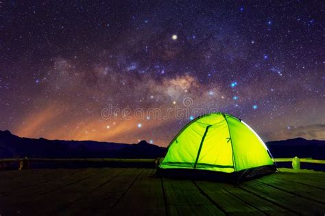 Camping Green Tent In Forest At Night And Star Background Stock Photo