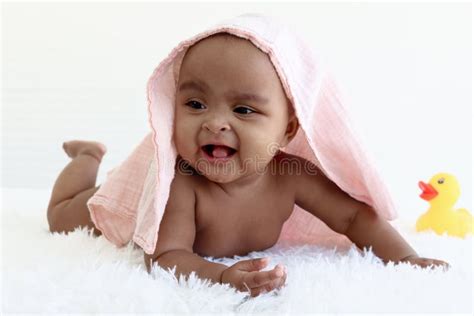 Portrait Of Adorable Six Month Crawling African American Baby Covered