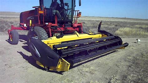 New Holland Self Propelled Swather Auctioneers Miller And Associates