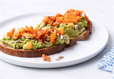 Avocado Bean Toast With Sunflower Seeds And Kimchi The New Baguette