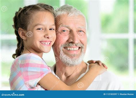 grandfather with her granddaughter hugging stock image image of elderly summer 112183397