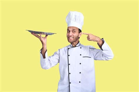 Premium Photo Handsome Chef Cook White Outfit Holding Plate Indian Pakistani Model