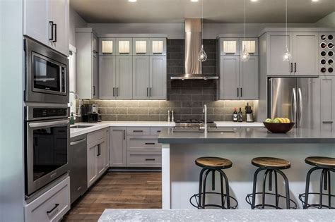 The beach style kitchen is possible with pendant lightings and bar chairs! Grey Kitchen Cabinets Design 1 (Grey Kitchen Cabinets ...