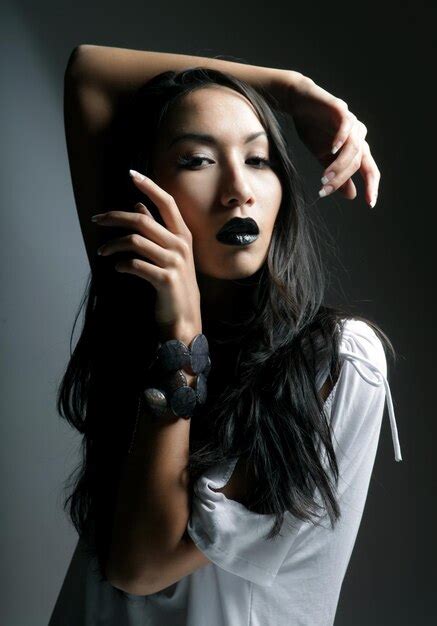 premium photo beautiful sensual asian woman model with black lips posing in fashionable dress