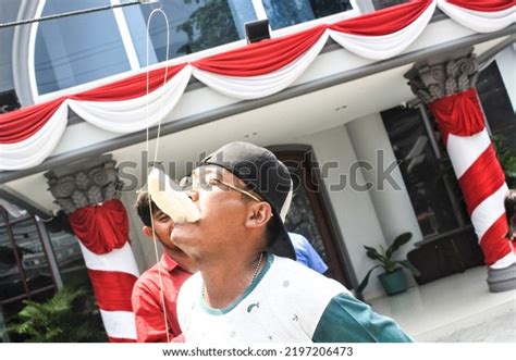 Cracker Eating Contest On Indonesias Independence Stock Photo