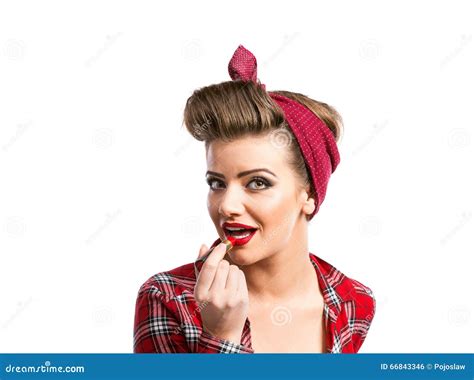 Woman With Pin Up Make Up And Hairstyle Applying Red Lipstick Stock