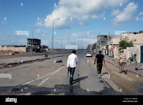 Members Of Misrata Militia Walk Through The Battle Ravaged Streets Of