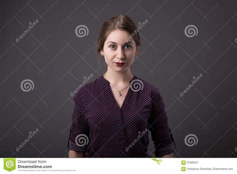 Stylish Young Businesswoman With A Friendly Expression Looking Directly