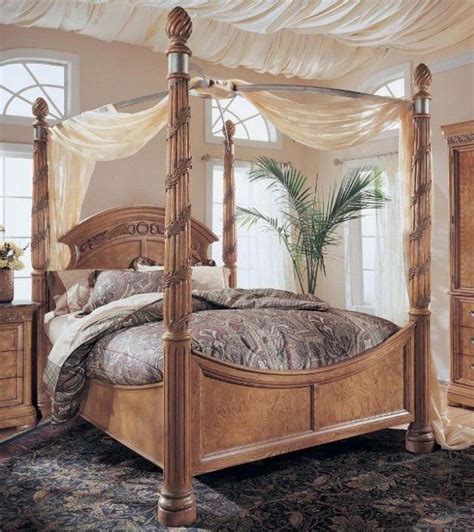 Wood Canopy Bed Design With Light Brown Finishes Home Interiors