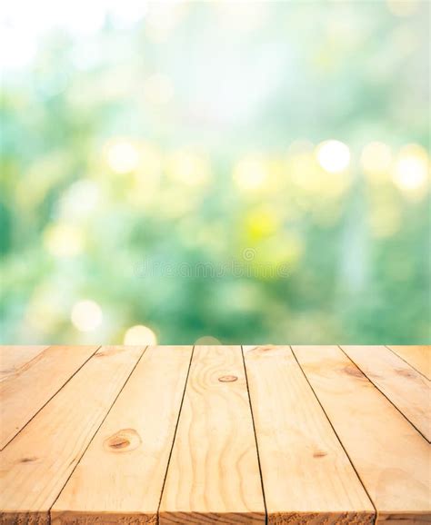 Real Wood Table Top Texture On Blur Leaf Tree Garden Background Stock