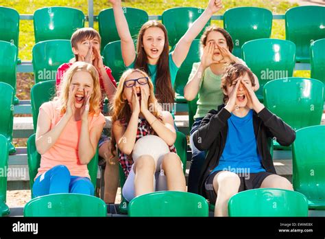 Happy Teenagers Cheer For The Team During Game Stock Photo Alamy