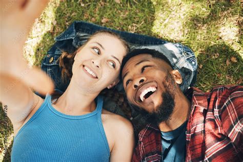 Interracial Couple Park Selfie And Lying On Grass With Smile Love And