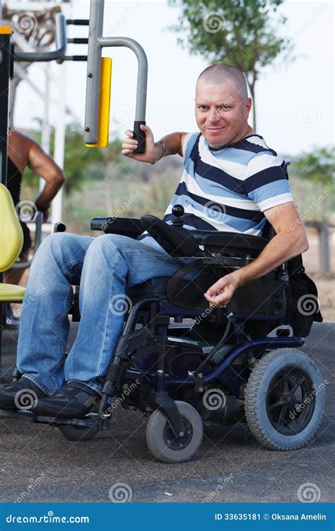 Disabled Male Veteran Is Sitting In Wheelchair Woman Is Sitting Nearby Stock Image