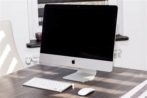 Royalty Free Photo White Imac With Apple Keyboard And Magic Mouse
