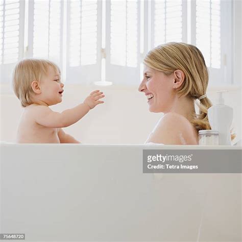 mother daughter in bathtub photos and premium high res pictures getty images