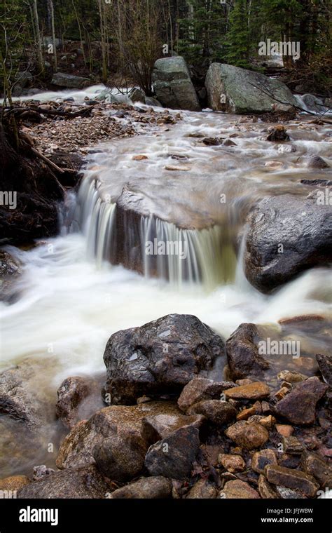 Water Flows Through A Series Of Cascades In Glacier Creek During The
