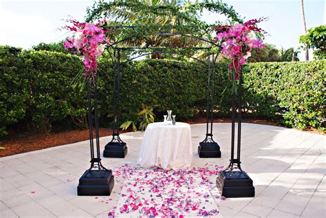 Black Metal Wedding Arch With Fuchsia Floral Accents