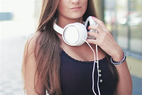 Portrait Photography Of Woman Holding Headphones · Free Stock Photo