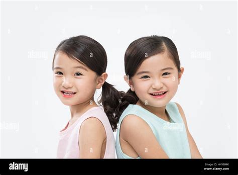 Smiling Twin Girls Stock Photo Alamy