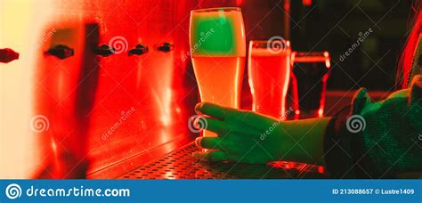 Young Woman With Beer Glasses Behind The Bar Counter In Soft Red Neon Light Stock Image Image